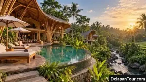 Resor bambu mewah di tengah hutan tropis Bali dengan kolam renang dan aliran sungai alami.
